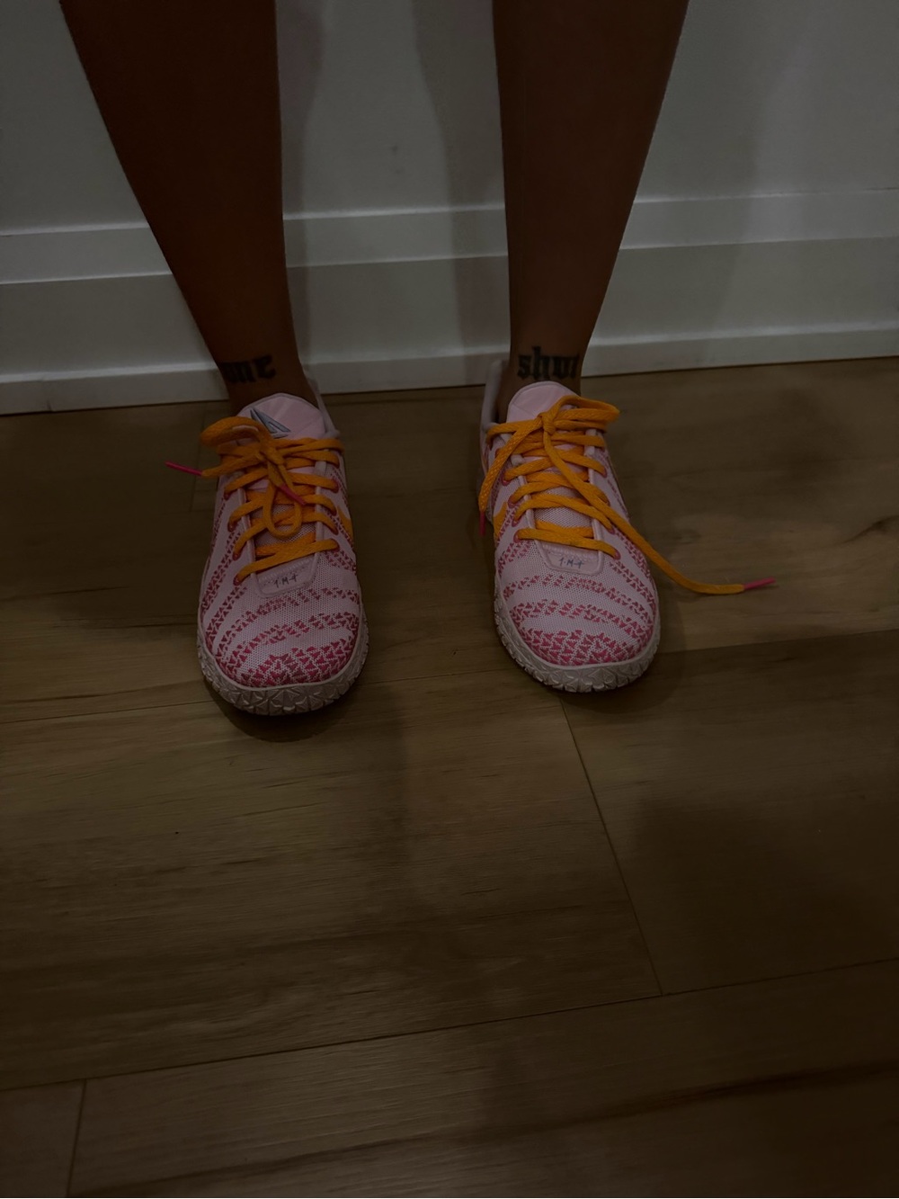 Nike Women’s Pink Patterned Sneakers with Orange Laces
